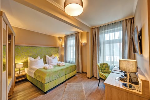 Deluxe Double Room | Minibar, in-room safe, individually decorated, desk