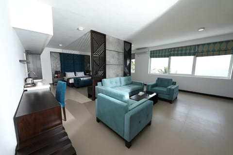 Executive Suite, Sea View | Living room | Flat-screen TV