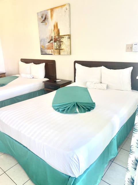 Premium with a Queen or 2 Double Beds, AC Ocean/PoolView | In-room safe, individually decorated, individually furnished