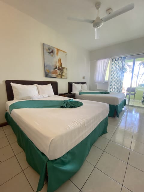 Premium with a Queen or 2 Double Beds, AC Ocean/PoolView | In-room safe, individually decorated, individually furnished