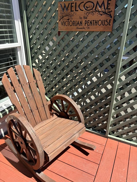 Welcome Victorian Penthouse sign in front of entrance to apartment.