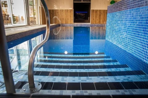 Indoor pool, open 7:00 AM to 8:00 PM, sun loungers