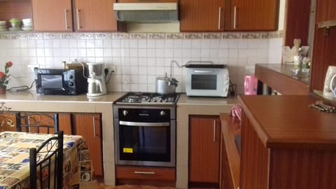 Comfort Villa, Multiple Bedrooms | Private kitchen | Full-size fridge, microwave, oven, stovetop