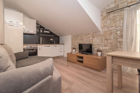 Apartment, 1 Bedroom, Balcony | Living area | Flat-screen TV