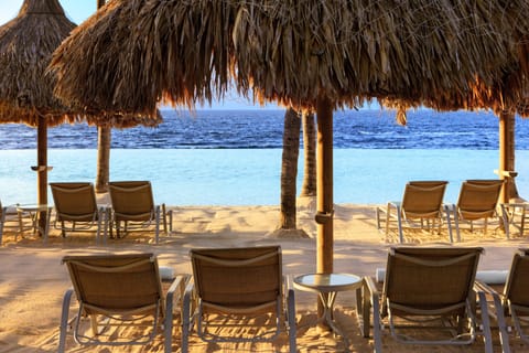 Private beach, white sand, sun loungers, beach umbrellas