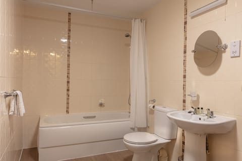 Combined shower/tub, designer toiletries, hair dryer, towels