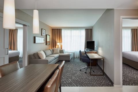 Suite, 2 Bedrooms | Living room | 40-inch LED TV with cable channels, TV