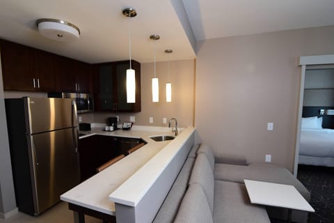 Suite, 1 Bedroom | Private kitchen | Full-size fridge, microwave, stovetop, dishwasher