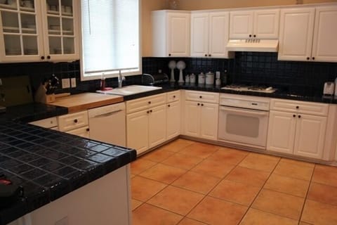 Lovely Gourmet Kitchen with Trash Compactor, DW, Double Ovens and Stove Top.