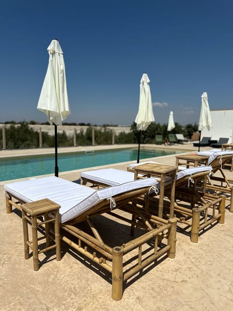 Outdoor pool, free cabanas, pool umbrellas