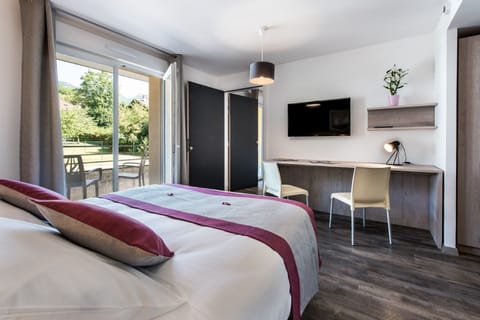 Family Room | Premium bedding, in-room safe, desk, iron/ironing board