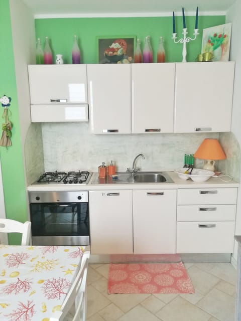 Deluxe Apartment, 1 Bedroom, Kitchenette, Ground Floor | Private kitchen | Full-size fridge, stovetop, coffee/tea maker, electric kettle