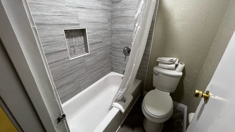 Deluxe Queen Room with Two Queen Beds | Bathroom | Shower, towels