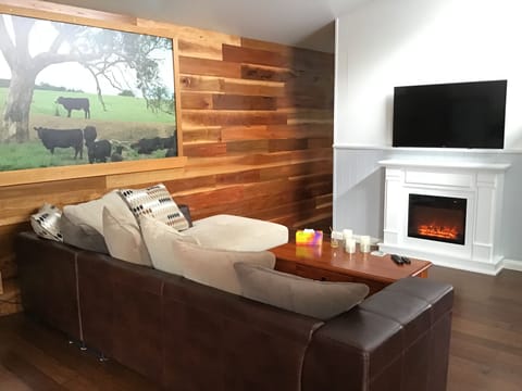Deluxe Studio Suite, 1 Queen Bed | Living area | TV