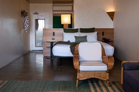 Superior Poolside Suite | Minibar, in-room safe, laptop workspace, iron/ironing board