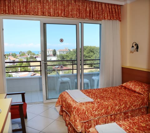 Standard Room, Partial Sea View | In-room safe, desk, free cribs/infant beds, free WiFi