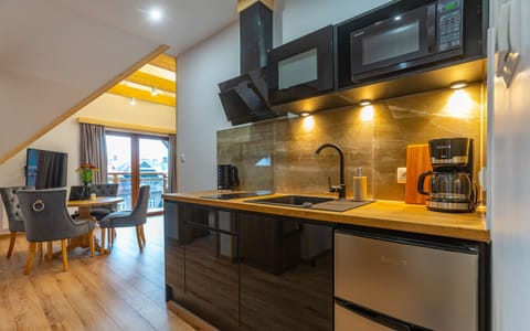 Penthouse | Private kitchen | Fridge, stovetop, coffee/tea maker, electric kettle