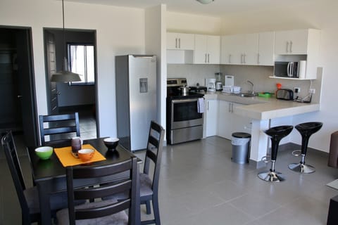 Deluxe Apartment, 2 Bedrooms, Non Smoking | Private kitchen | Full-size fridge, microwave, oven, stovetop