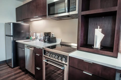 Suite, 1 Bedroom | Private kitchen | Full-size fridge, microwave, stovetop, dishwasher