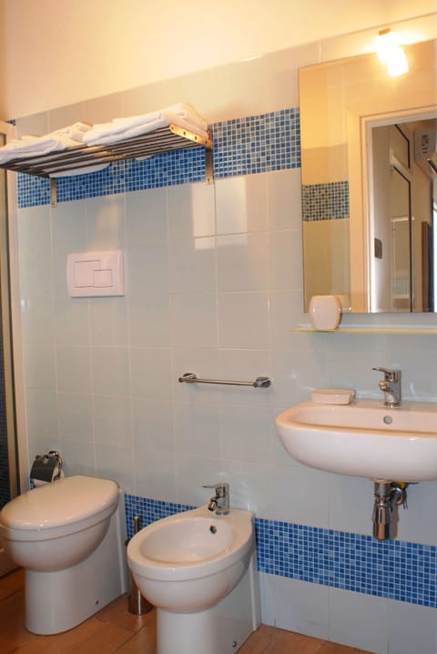 Family Triple Room, Balcony | Bathroom | Shower, rainfall showerhead, free toiletries, hair dryer