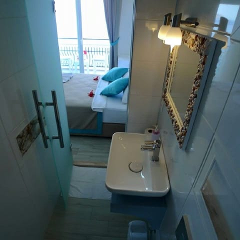 Standard Double Room, Sea View | Bathroom | Shower, hair dryer, slippers, towels