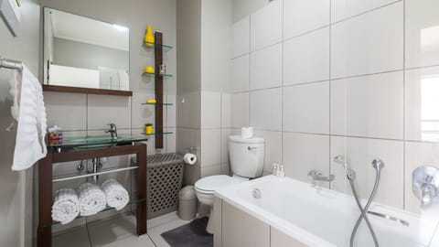 1 Bed Apartment, First Floor | Bathroom | Combined shower/tub, deep soaking tub, free toiletries, hair dryer