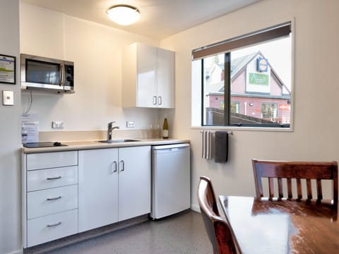 One Bedroom Spa | Private kitchen | Fridge, microwave, stovetop, electric kettle