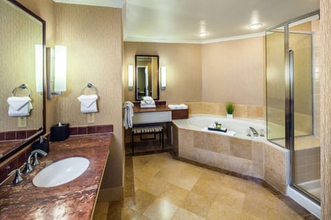 Suite, 1 King Bed, Jetted Tub | Bathroom | Combined shower/tub, free toiletries, hair dryer, towels