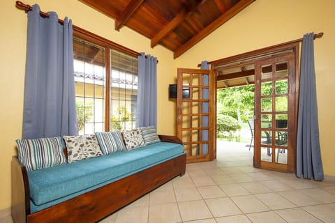 Classic Villa, 2 Bedrooms, Kitchenette, Garden View | Living area | 32-inch flat-screen TV with cable channels, TV