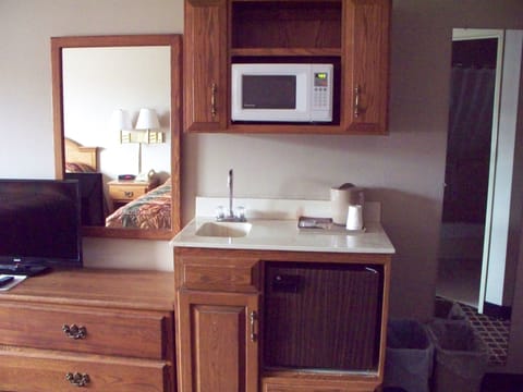 Standard Room, 2 Queen Beds | Private kitchen | Mini-fridge, microwave, coffee/tea maker, highchair