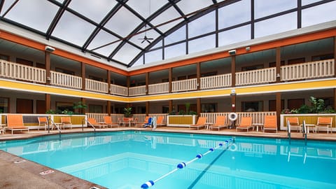 Indoor pool, open 8:00 AM to 10:00 PM, pool umbrellas, sun loungers