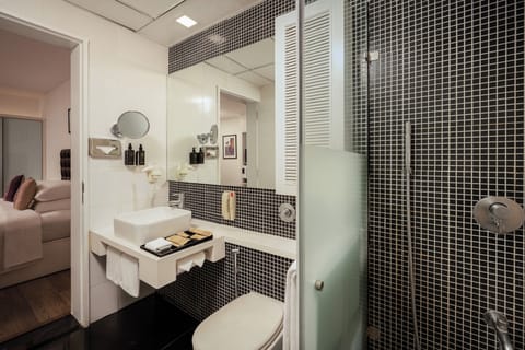 Suite, 1 Bedroom, Balcony | Bathroom | Shower, rainfall showerhead, designer toiletries, hair dryer