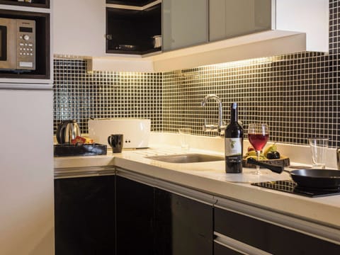 Suite, 1 Bedroom, Balcony | Bathroom | Shower, rainfall showerhead, designer toiletries, hair dryer