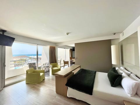 Suite, Sea View | Minibar, in-room safe, desk, iron/ironing board