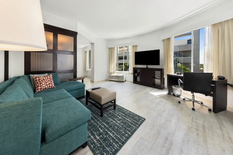 Suite, 1 King Bed | Living area | 42-inch plasma TV with digital channels, TV, MP3 dock