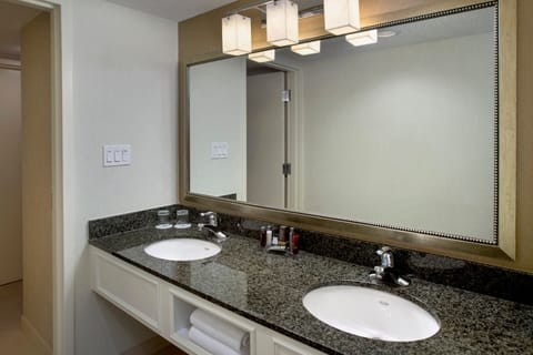 Suite, 1 King Bed | Bathroom | Combined shower/tub, designer toiletries, hair dryer, towels