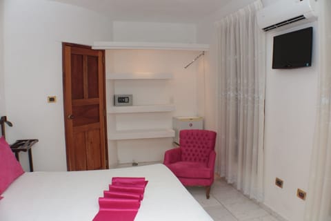 Standard Double Room | Minibar, in-room safe, iron/ironing board, bed sheets