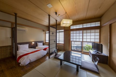 Main Building IORI - Triple Room with Partial Open-air Hot Spring Bath	 | In-room safe, free WiFi