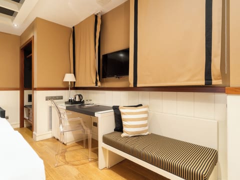 Family Triple Room | Minibar, in-room safe, desk, laptop workspace