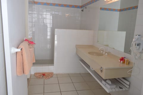 Frangipani Bure | Bathroom | Separate tub and shower, rainfall showerhead, free toiletries