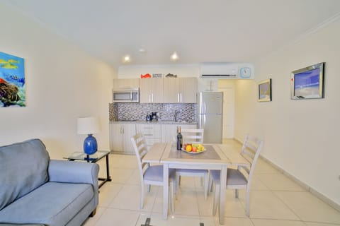 Condo, 1 Bedroom | Living area | Flat-screen TV