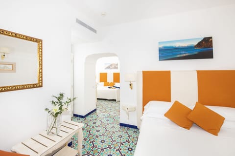 Family Quadruple Room | 1 bedroom, minibar, in-room safe, individually decorated