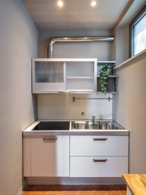 Deluxe Suite, Ground Floor (Olivi) | Private kitchen | Mini-fridge, highchair