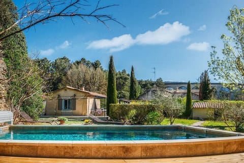 Outdoor swimming pool with wooden deck