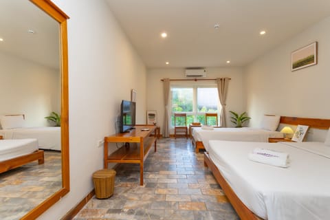 Superior Triple Room, 1 Bedroom, Resort View, Garden Area | Minibar, in-room safe, desk, blackout drapes