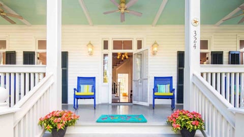 A classic front porch graces the facade of the home...