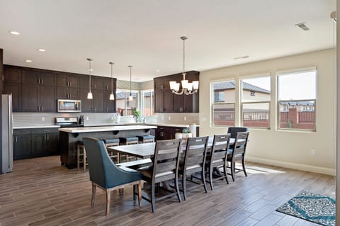 Large Dining table and bar seating to sit 16 people.