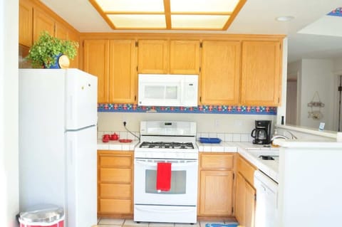 Bright and clean kitchen loaded with all cooking necessities needed to prepare a delicious meal