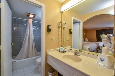 One King Bed, Non-Smoking | Bathroom | Bathtub, free toiletries, hair dryer, towels