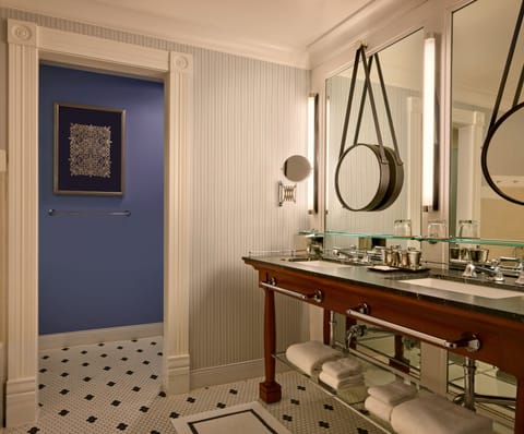 Separate tub and shower, designer toiletries, hair dryer, bathrobes